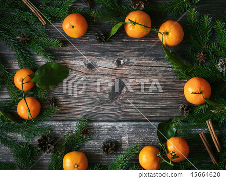 Christmas holiday card with tangerines and fir branches and pine cones 45664620
