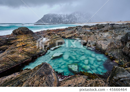 Rocky coast of fjord in Norway 45666464