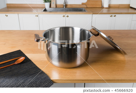 Stainless steel pot in the kitchen Stainless steel pot in the kitchen 45666920