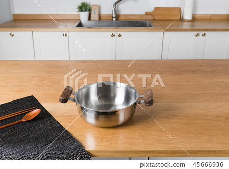 Stainless steel pot in the kitchen Stainless steel pot in the kitchen 45666936