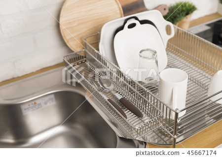 Kitchen with various kitchen tools, kitchen lathe and plants background. Dry dish and bowl shaped. Kitchen with various kitchen tools, kitchen lathe and plants background. Dry dish and bowl shaped. 45667174