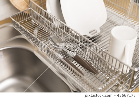 Kitchen with various kitchen tools, kitchen lathe and plants background. Dry dish and bowl shaped. 45667175