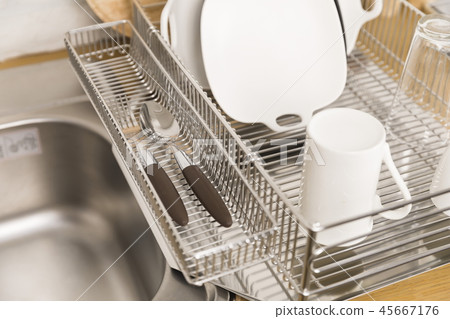 Kitchen with various kitchen tools, kitchen lathe and plants background. Dry dish and bowl shaped. Kitchen with various kitchen tools, kitchen lathe and plants background. Dry dish and bowl shaped. 45667176