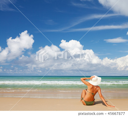 Young attractive woman relax on the sea beach 45667877