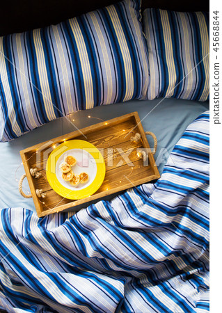 cheese pancakes on a tray-breakfast in bed, the inscription I love you-St. Valentine's Day 45668844