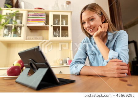 Woman talking through a video chat Woman talking through a video chat 45669293