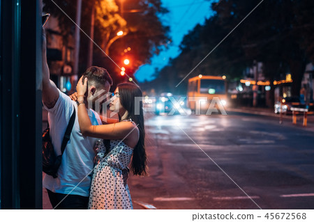 Young couple in the streets of the evening city 45672568