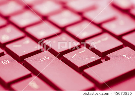 Macro keys of keyboard with wine color toning, angle view, soft background with copy space 45673830