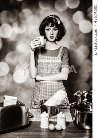 housewife standing in the kitchen near the dishes 45674600