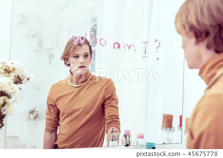 Appealing delightful trans man feeling happy with his new dress Appealing delightful trans man feeling happy with his new dress 45675778