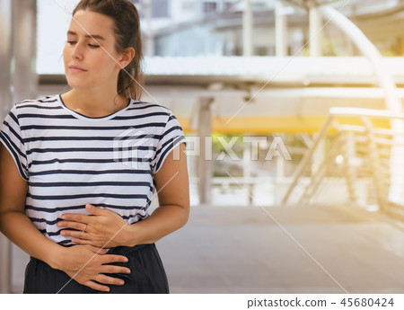 Woman having painful stomachache,Female suffering Woman having painful stomachache,Female suffering 45680424