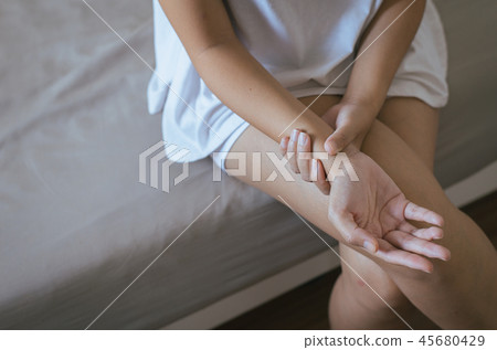 Woman hand checking pulse with fingers in wrist Woman hand checking pulse with fingers in wrist 45680429