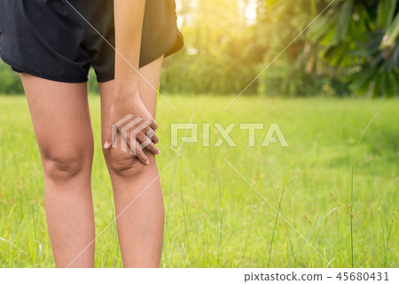 Woman suffering from pain in leg and knee injury Woman suffering from pain in leg and knee injury 45680431