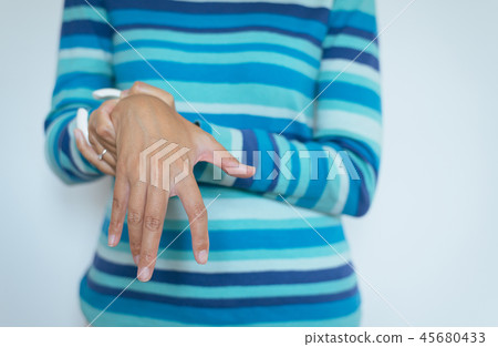 Hand woman suffering Parkinson disease symptoms Hand woman suffering Parkinson disease symptoms 45680433