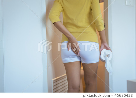 Woman sufferring with hemorrhoids at toilet Woman sufferring with hemorrhoids at toilet 45680438