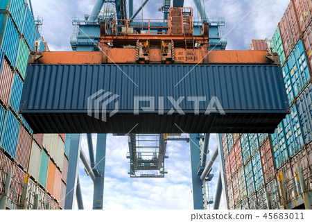 Crane loading Containers in freight ship. Crane loading Containers in freight ship. 45683011