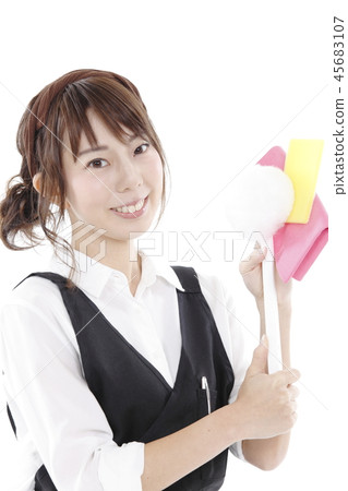 A woman with a cleaning tool A woman with a cleaning tool 45683107