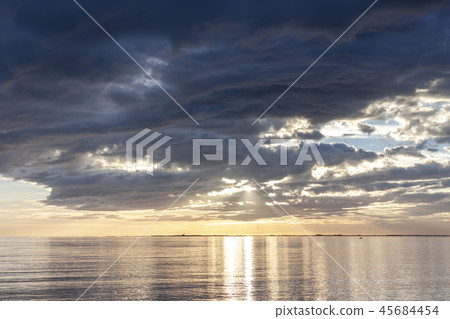 amazing sunset over the sea with dramatic clouds amazing sunset over the sea with dramatic clouds 45684454