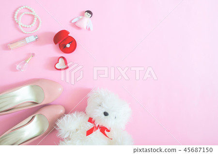 Creative flat lay of bride's essentials on pink 45687150