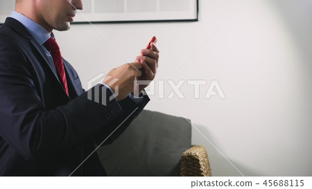 man flirts talking on video from his smartphone. the guy sends a kiss online during a video call man flirts talking on video from his smartphone. the guy sends a kiss online during a video call 45688115