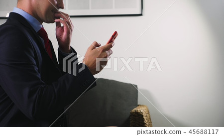 man uses smartphone. man read bad news in smartphone. man uses smartphone. man read bad news in smartphone. 45688117