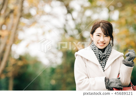 Japanese woman in a coat Winter park smile Japanese woman in a coat Winter park smile 45689121