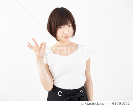 Woman putting out OK sign on white background 45691062