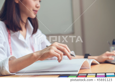 Businesswoman in office in casual shirt. 45691123