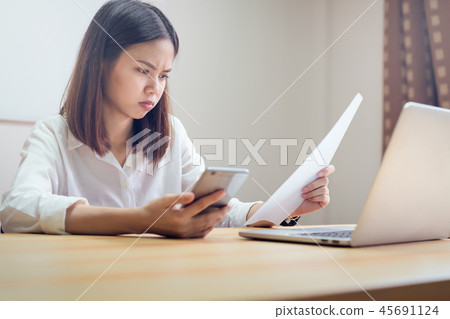 Businesswoman in office and use computer. 45691124