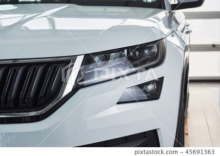 The headlights and the hood of a new luxury car. 45691363