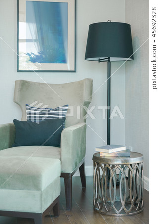 Black and white pillow on velvet louge chair 45692328