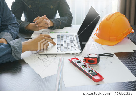 architect and engineer discussing during a meeting architect and engineer discussing during a meeting 45692333