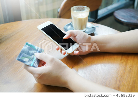 woman using smartphone for online shopping woman using smartphone for online shopping 45692339
