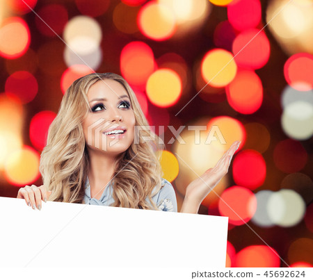 Glamorous woman with white empty paper board 45692624