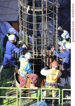 Construction site: Foundation work: Guide pipes and rebar connection work Construction site: Foundation work: Guide pipes and rebar connection work 45692934