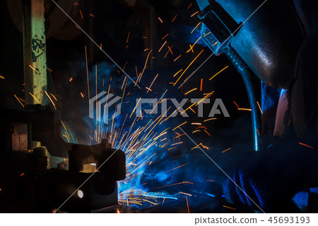 Industrial worker is welding in factory Industrial worker is welding in factory 45693193