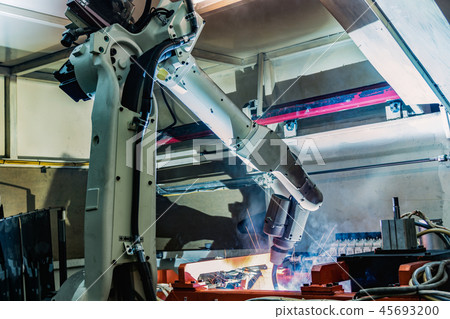 Team industrial robot are welding in factory 45693200