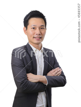 Portrait of young asian businessman keeping arms c Portrait of young asian businessman keeping arms c 45693357