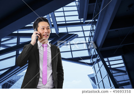 Portrait of asian businessman talking on the phone Portrait of asian businessman talking on the phone 45693358