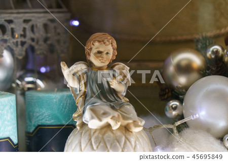 Angel figurine, white Christmas balls as the decor Angel figurine, white Christmas balls as the decor 45695849