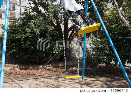 Girl on a swing 45696743