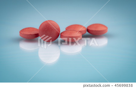Selective focus on orange round tablets pills 45699838