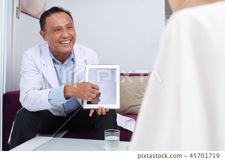 Discussing rhinoplasty with patient Discussing rhinoplasty with patient 45701719