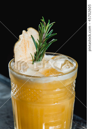 Cold Whiskey Sour Cocktail with ice and apple chips, piece of thyme on top Cold Whiskey Sour Cocktail with ice and apple chips, piece of thyme on top 45702605