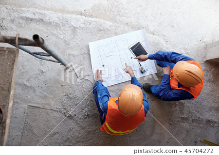 Discussing building plan Discussing building plan 45704272