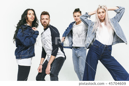 Group of smiling friends in fashionable jeans Group of smiling friends in fashionable jeans 45704609