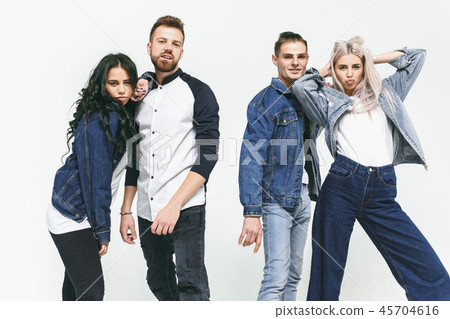 Group of smiling friends in fashionable jeans Group of smiling friends in fashionable jeans 45704616