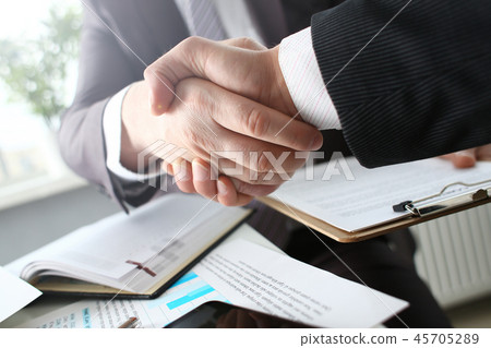 Man in suit shake hand as hello in office 45705289