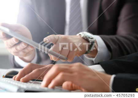 Two businessman are looking and Two businessman are looking and 45705293