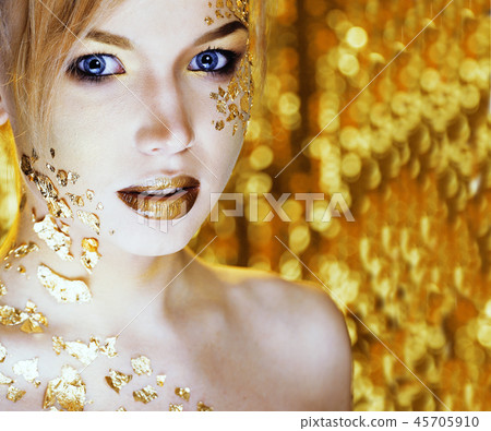 beauty blond woman with gold creative make up 45705910